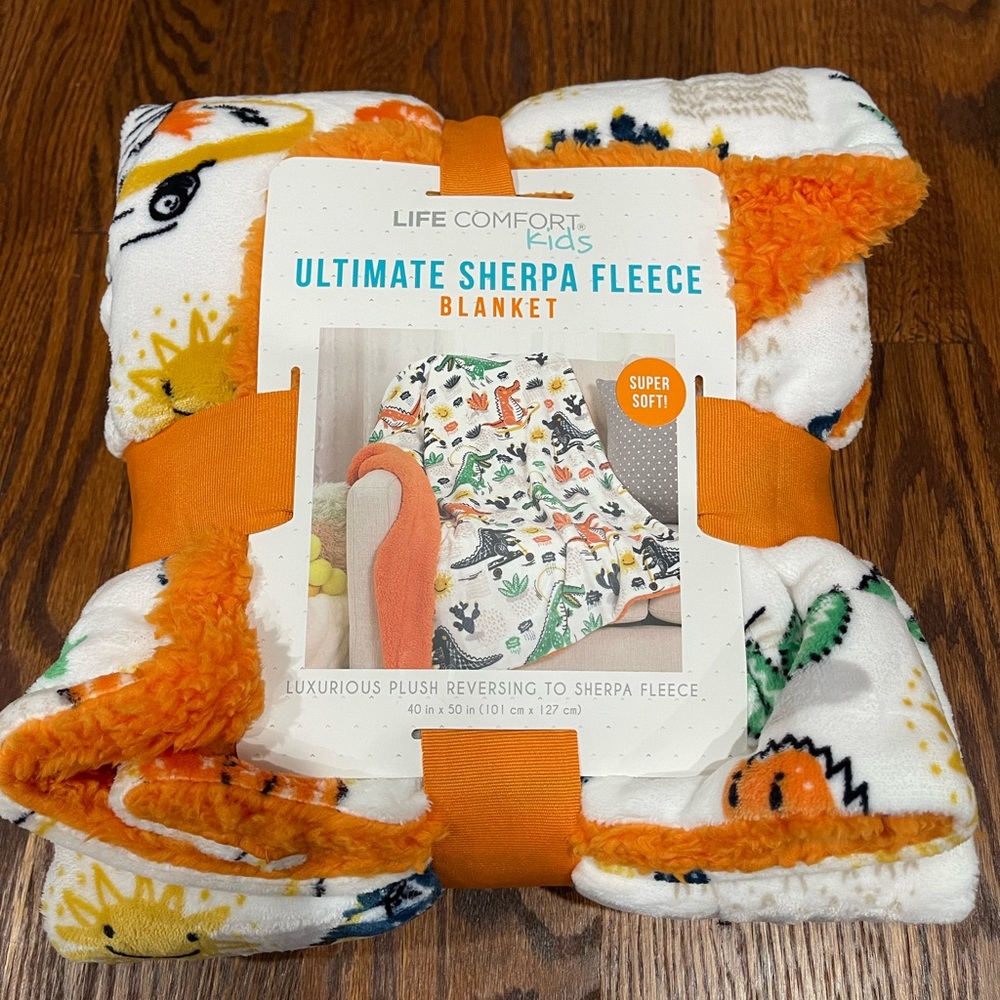 Printed plush face reverses to Sherpa fleece